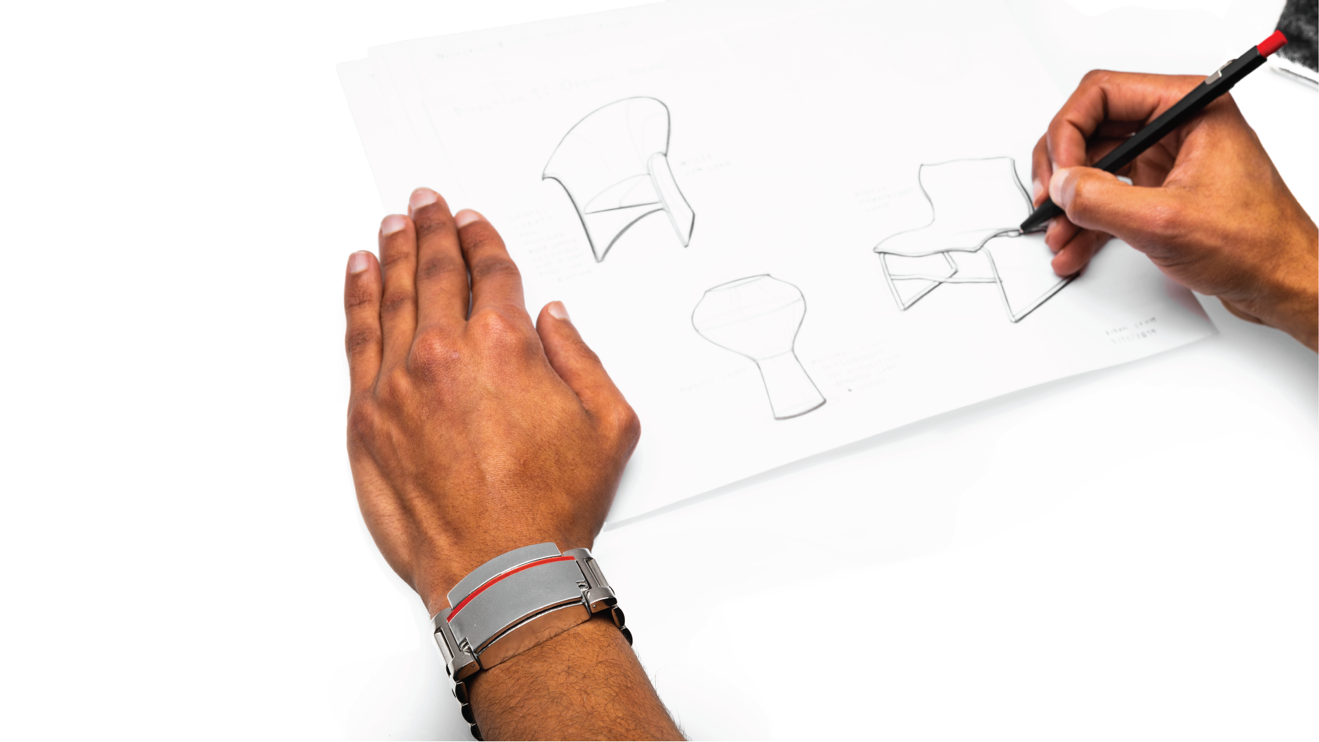 Person using the faceless wristwatch while sketching.