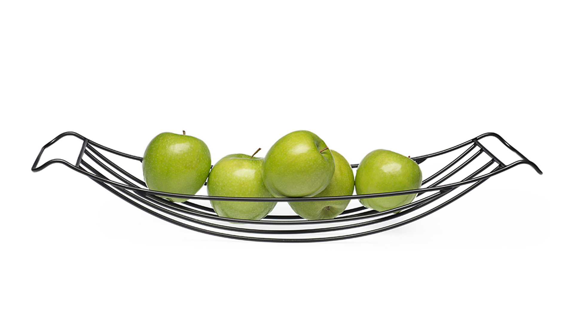 Long metal fruit bowl with green apples