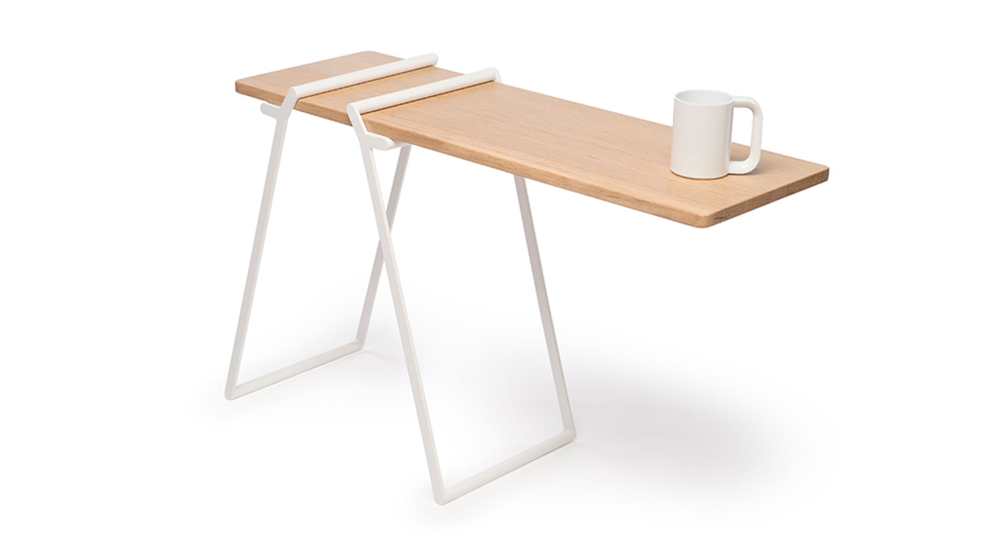 Flat wood table with 2 rectangular legs, one adjusted closer to other to create extended shelf