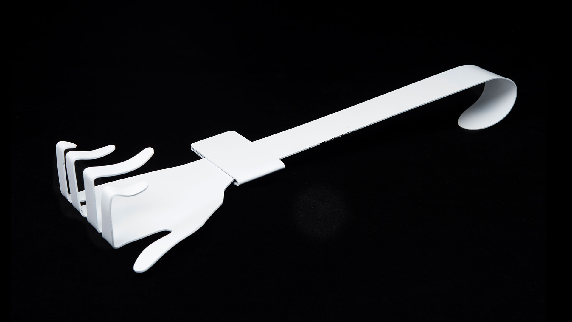 One white hand hook laying down with fingers pointed upward