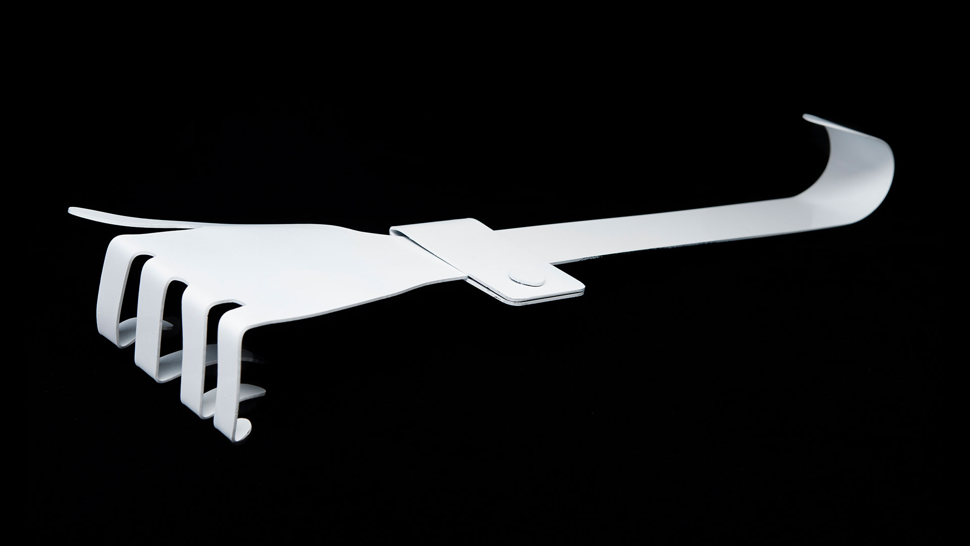 One white hand hook laying down with fingers pointed down 