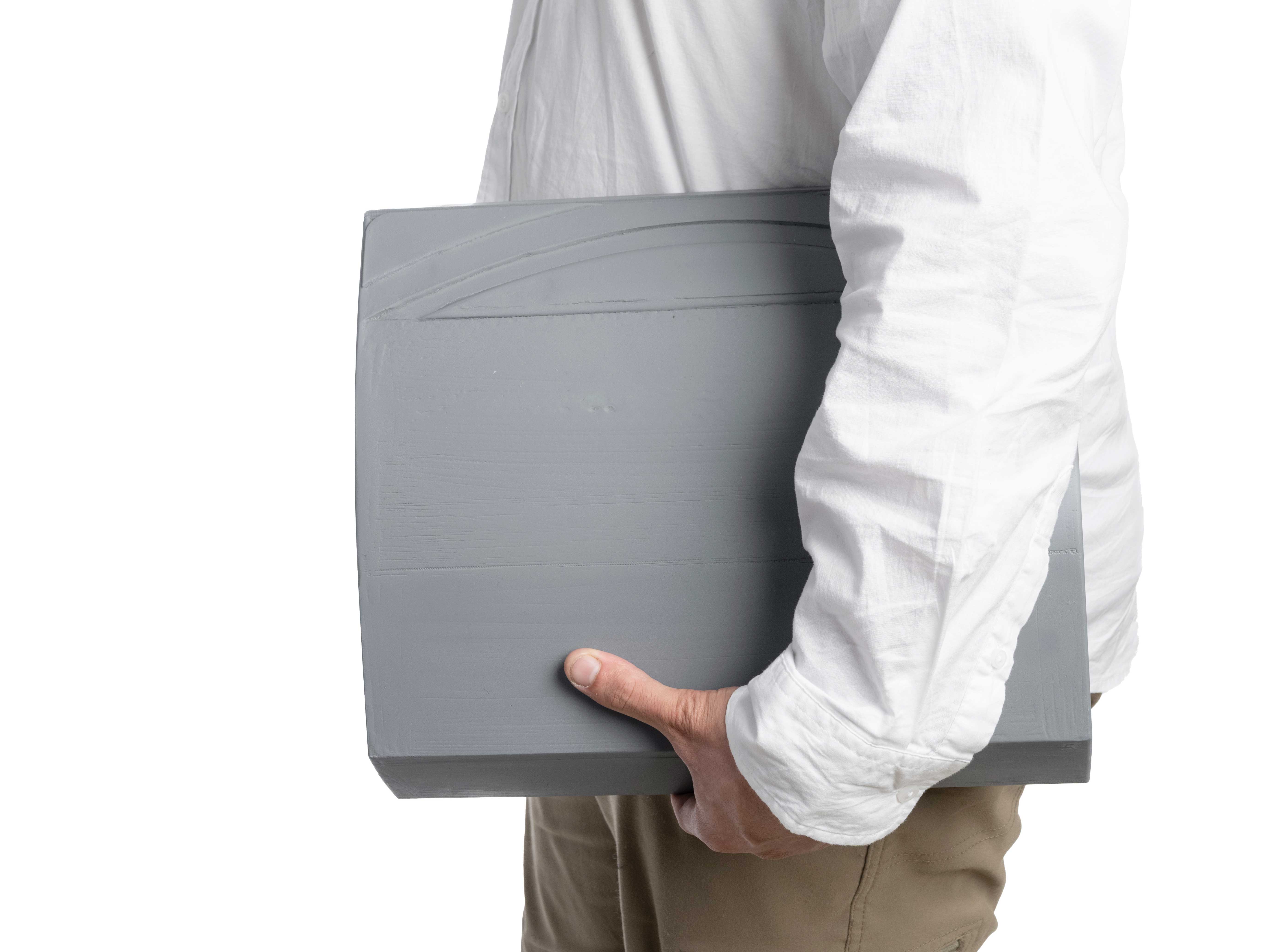 Photo of Kee Vault grey model being held.