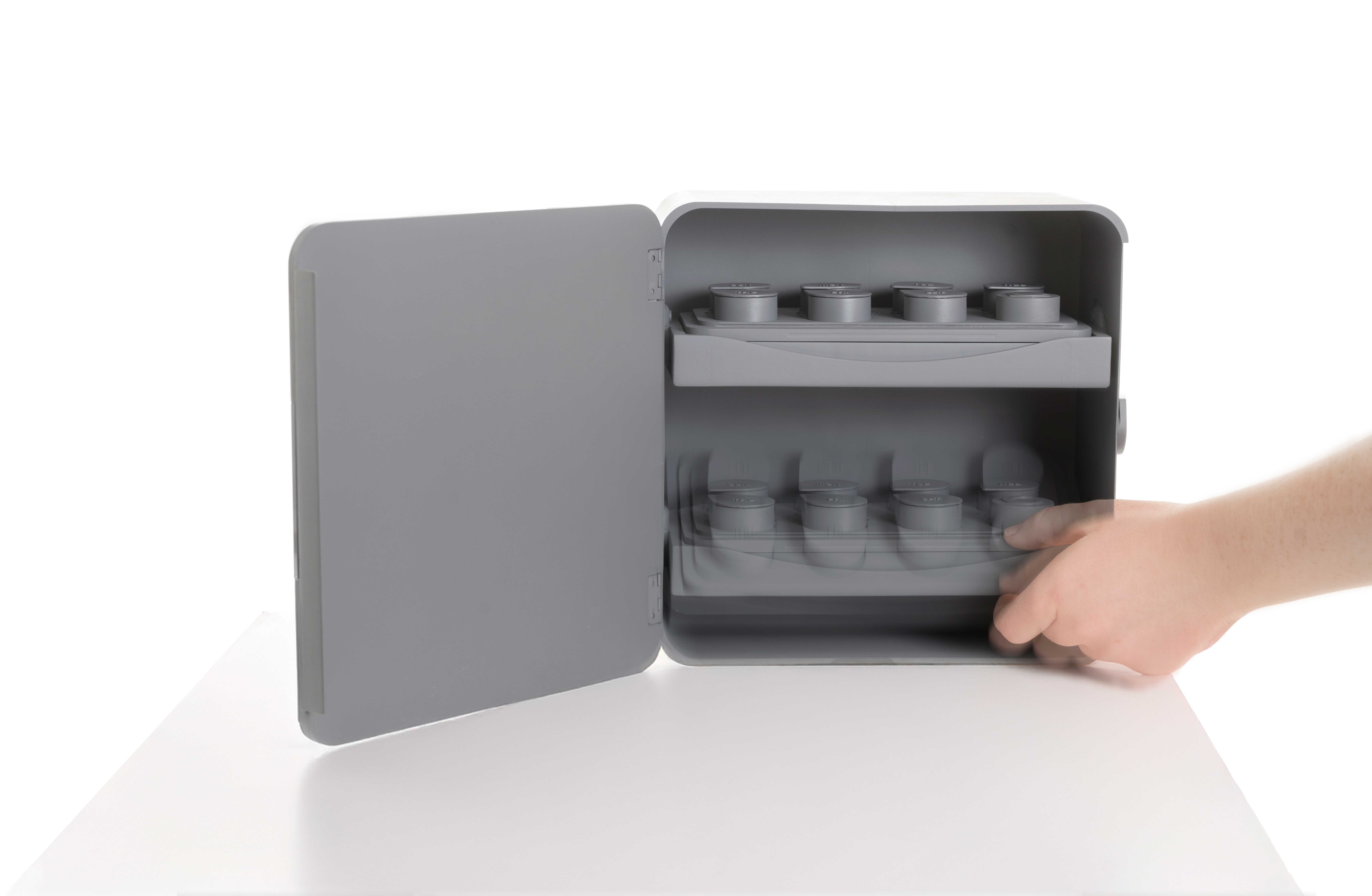 Photo of the Sorted Medicine Cabinet model open with hand pulling out the bottom tray.