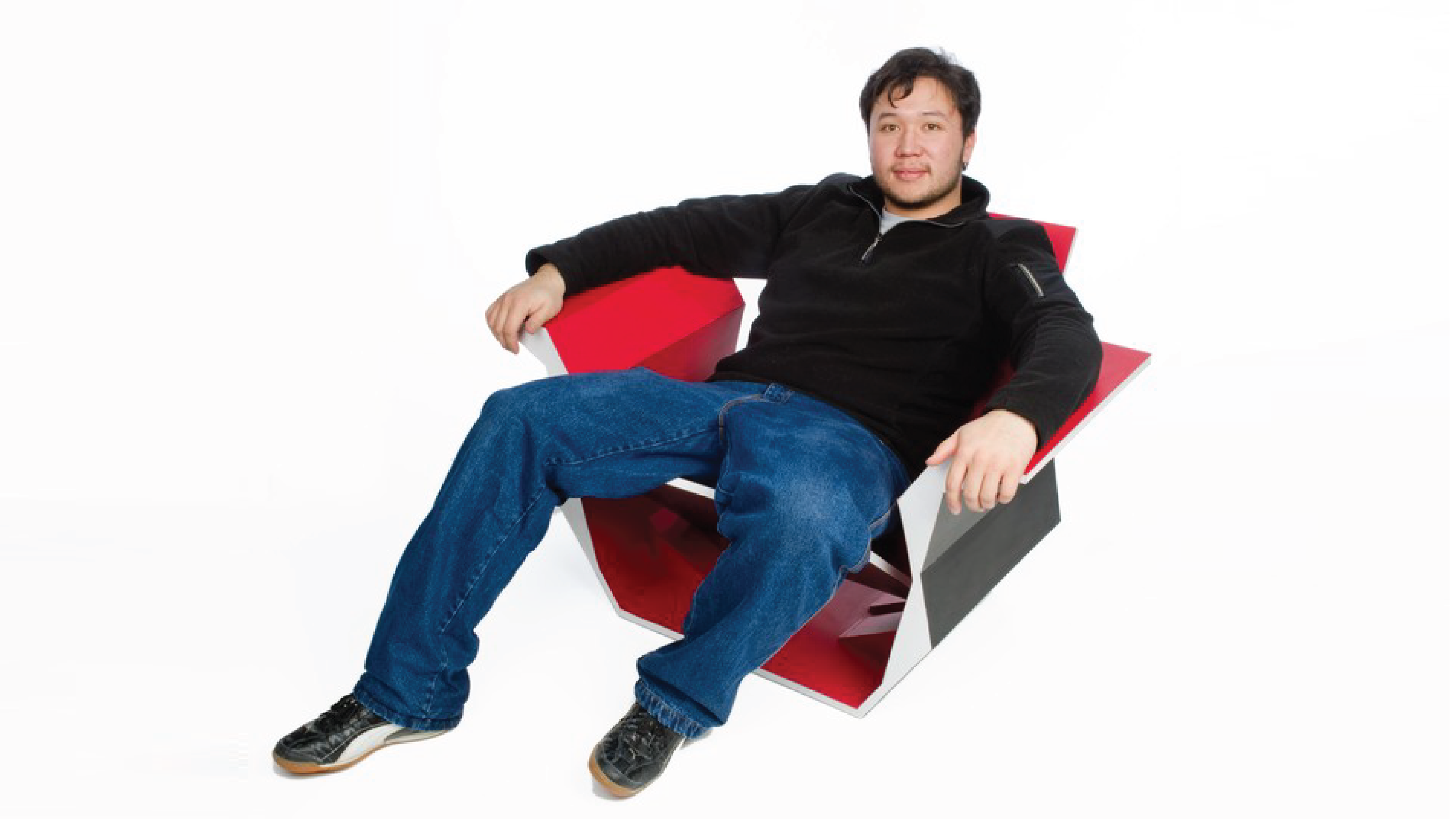 Student sitting at the red chair.