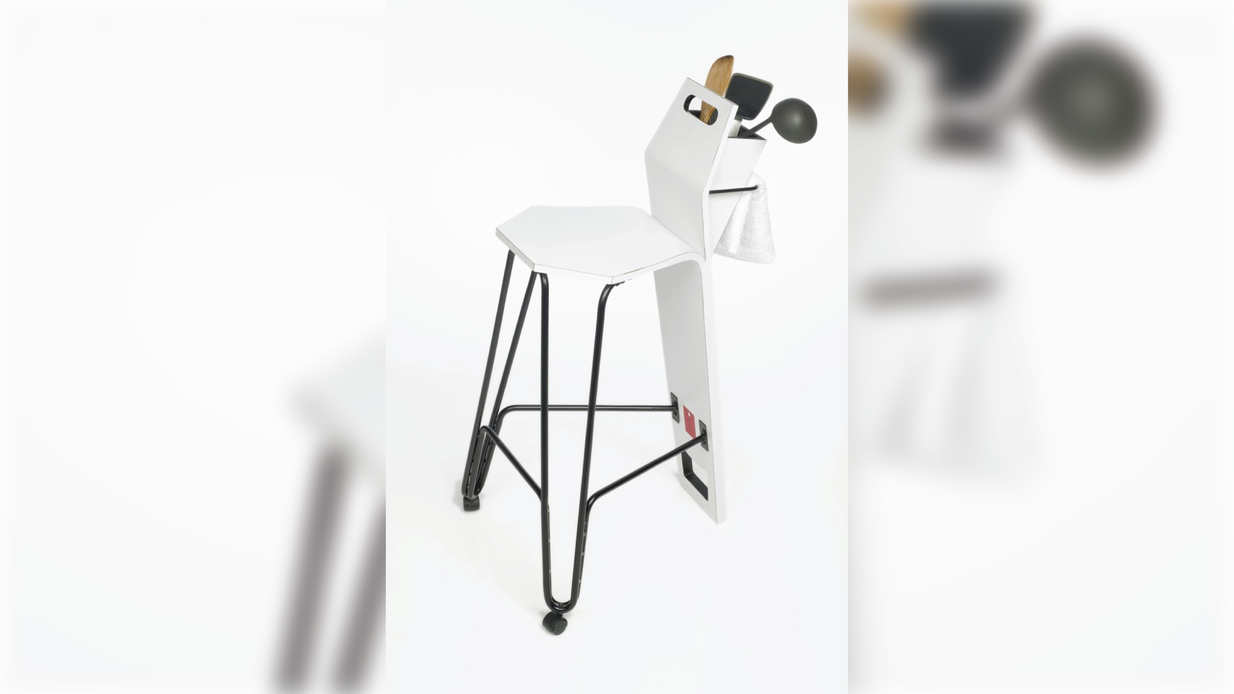 Stool holding kitchenware.