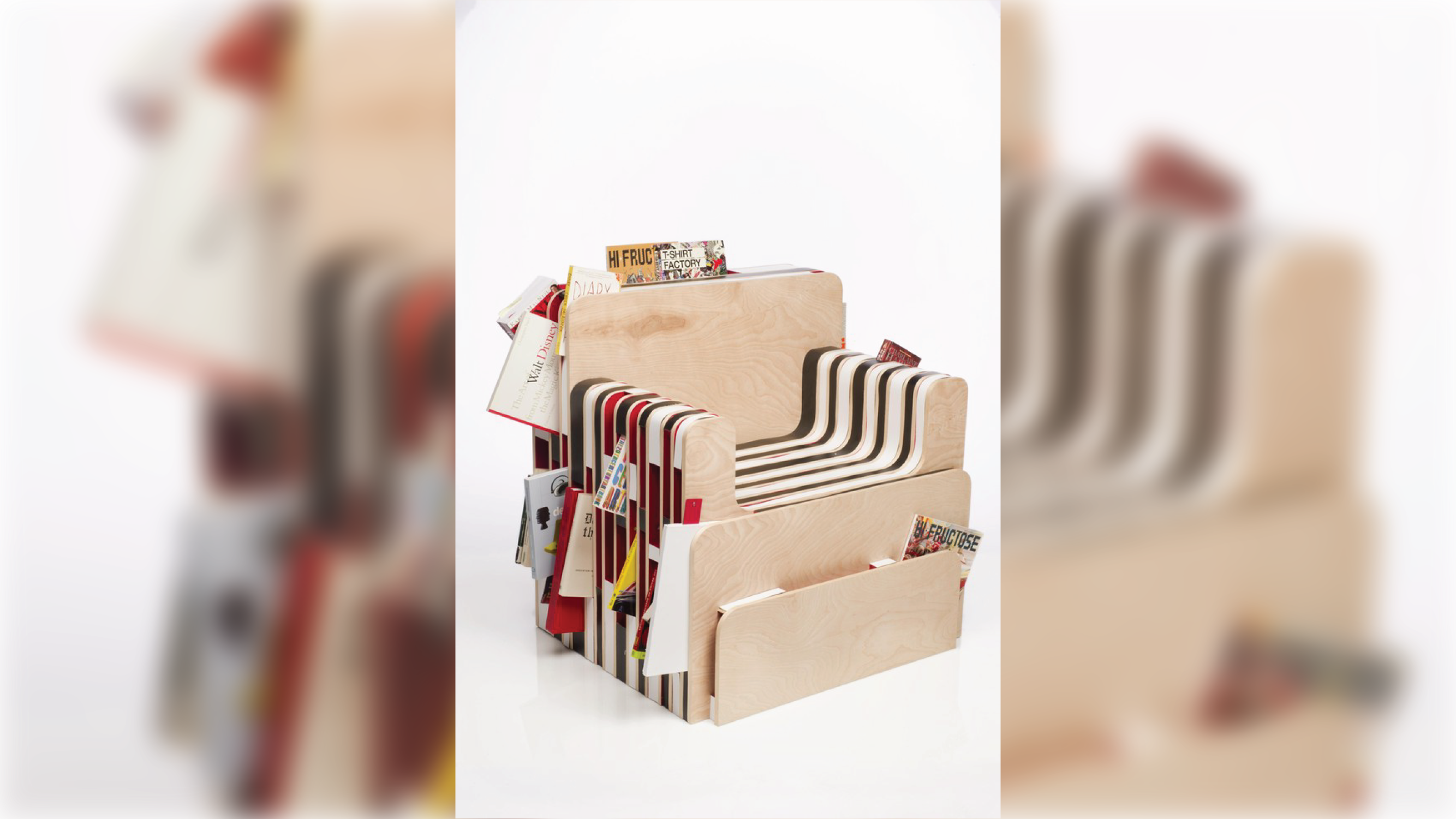 Armchair with shelves incorporated for storing reading material of varying sizes.