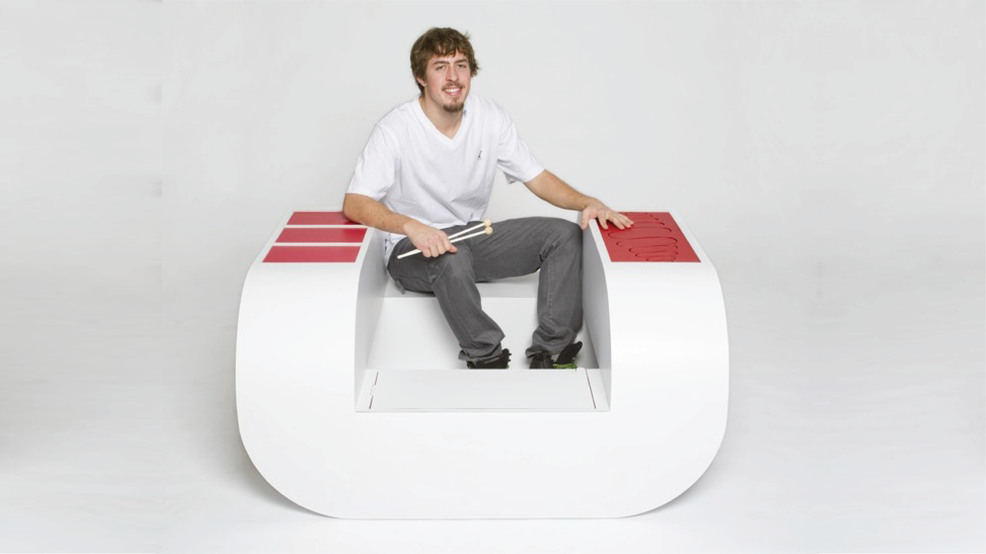 Student sitting at a chair with a U-shape.