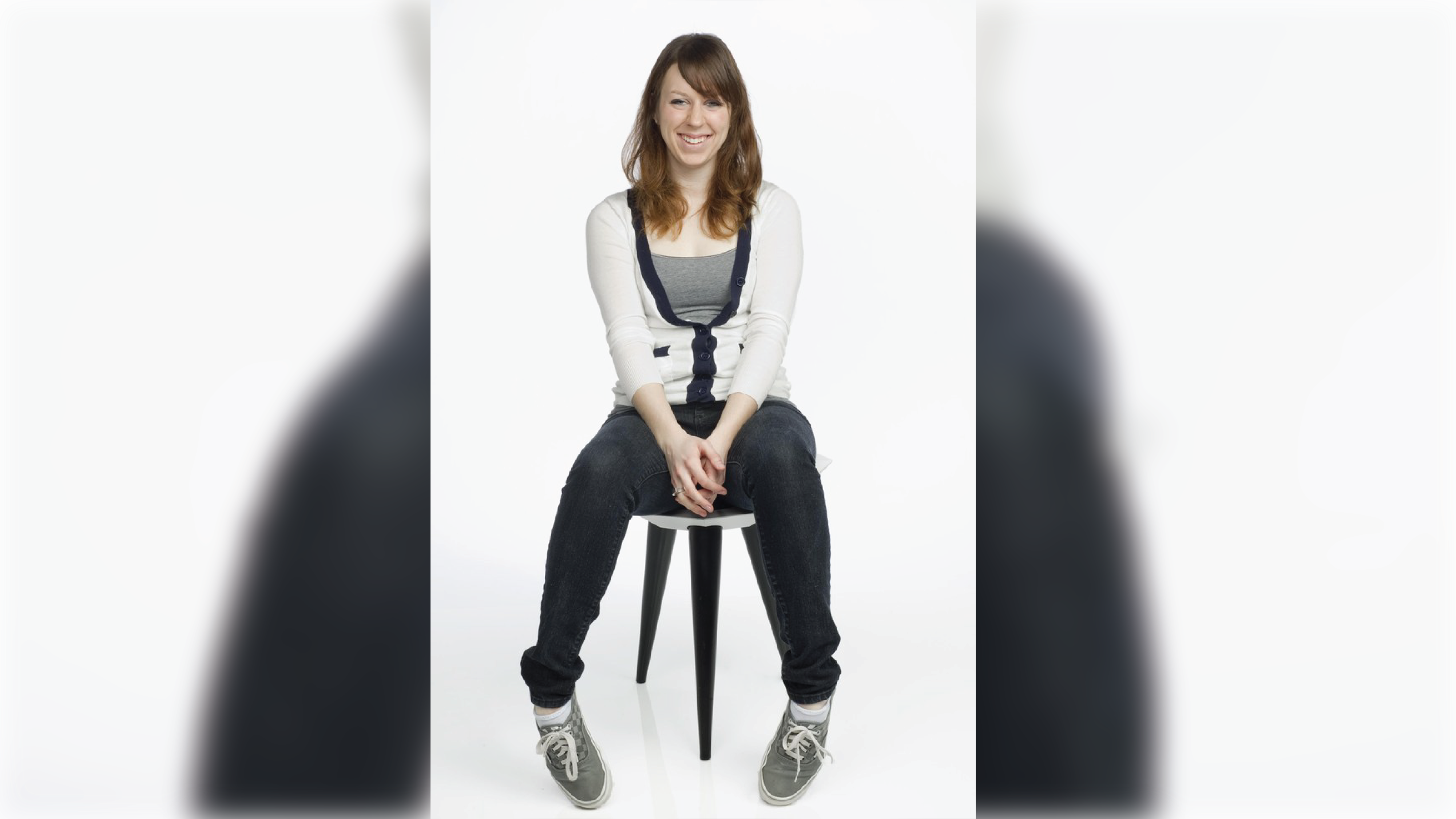 Student sitting at a 3-foot stool with a bowl-shape seat.