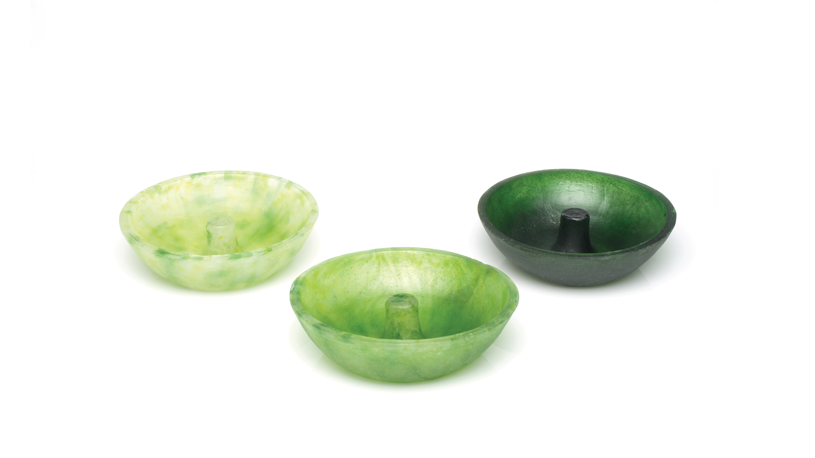 Three green ashtrays