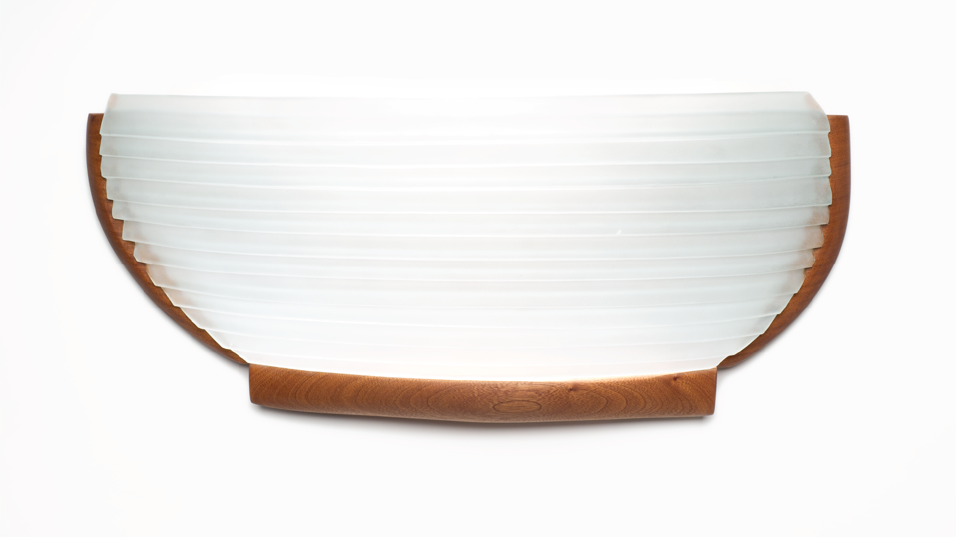 Wall sconce made with a wood structure and textured glass, presenting a space for an illuminated object. Lights inside the product are turned on.