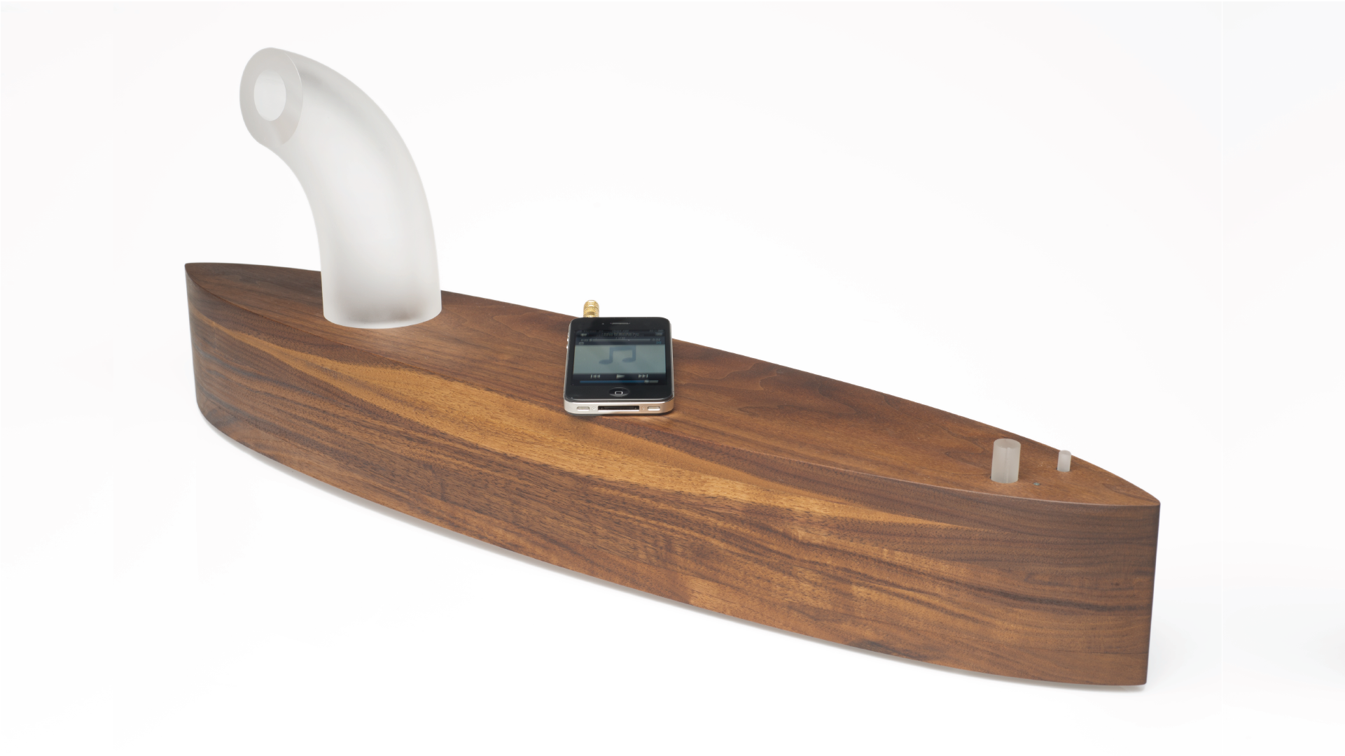 Speaker made with a solid wood piece as a base and a frost glass tube as channel for the sound.
