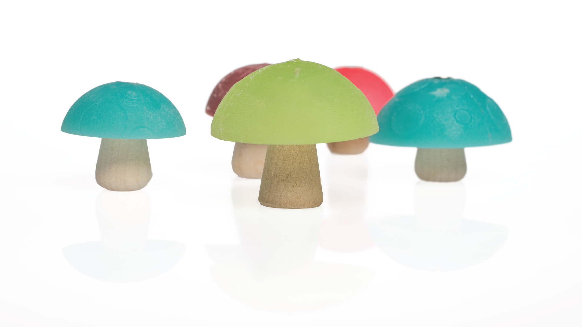 5 toys in a shape of a mushroom. The top cap is made of rubber and the stem is a simple wood conical shape.