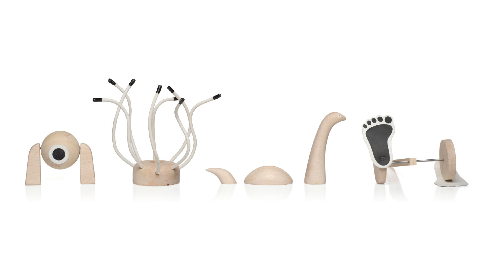 Four wooden toys that represent monsters of the ancient cultures.