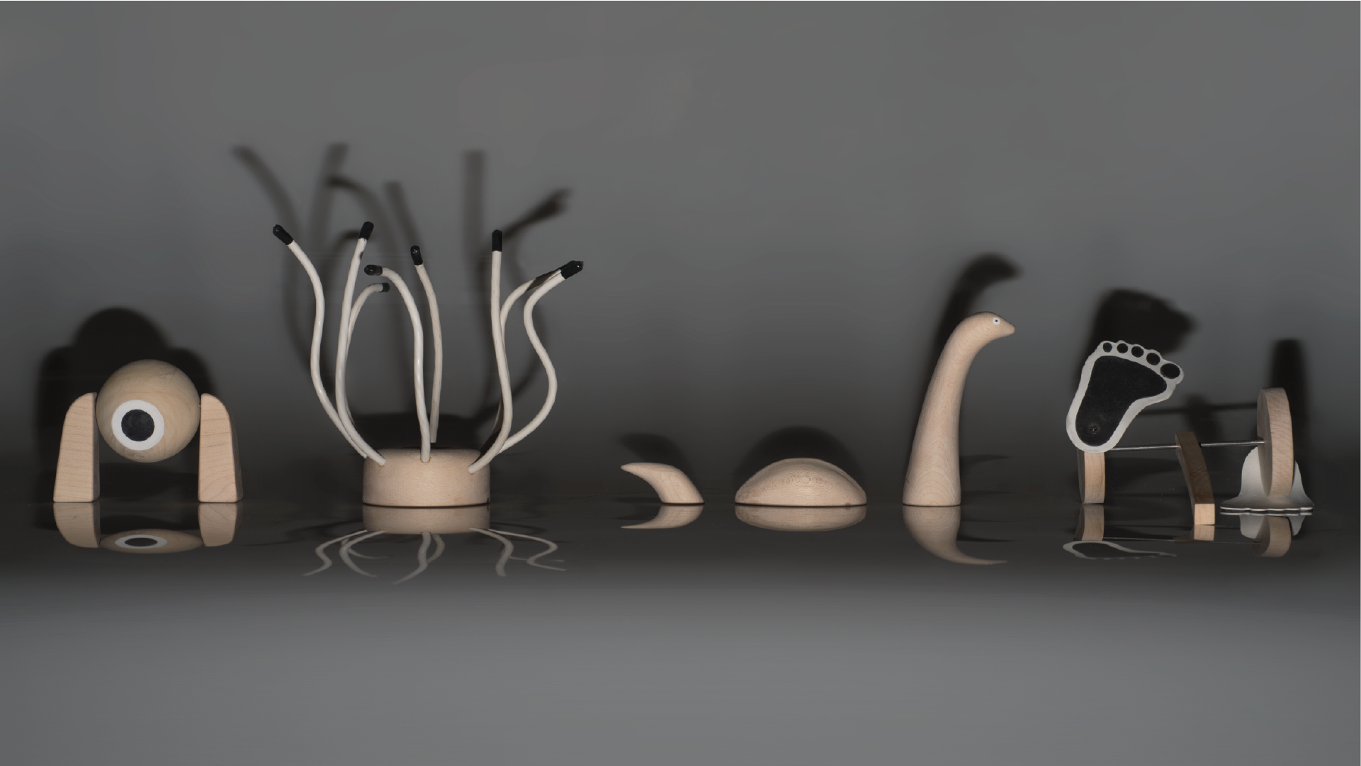 Four wooden toys that represent monsters of the ancient cultures.