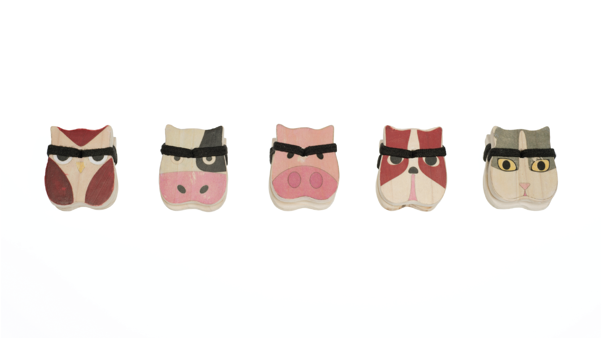 Five wooden clips with animal figure themes.