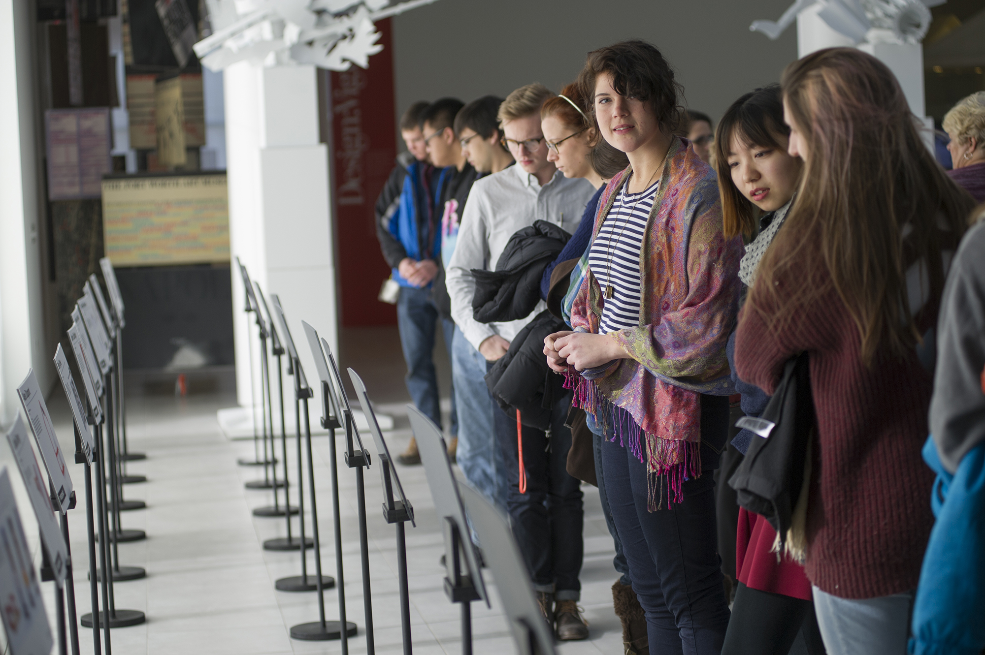A group of students stand in University Gallery.