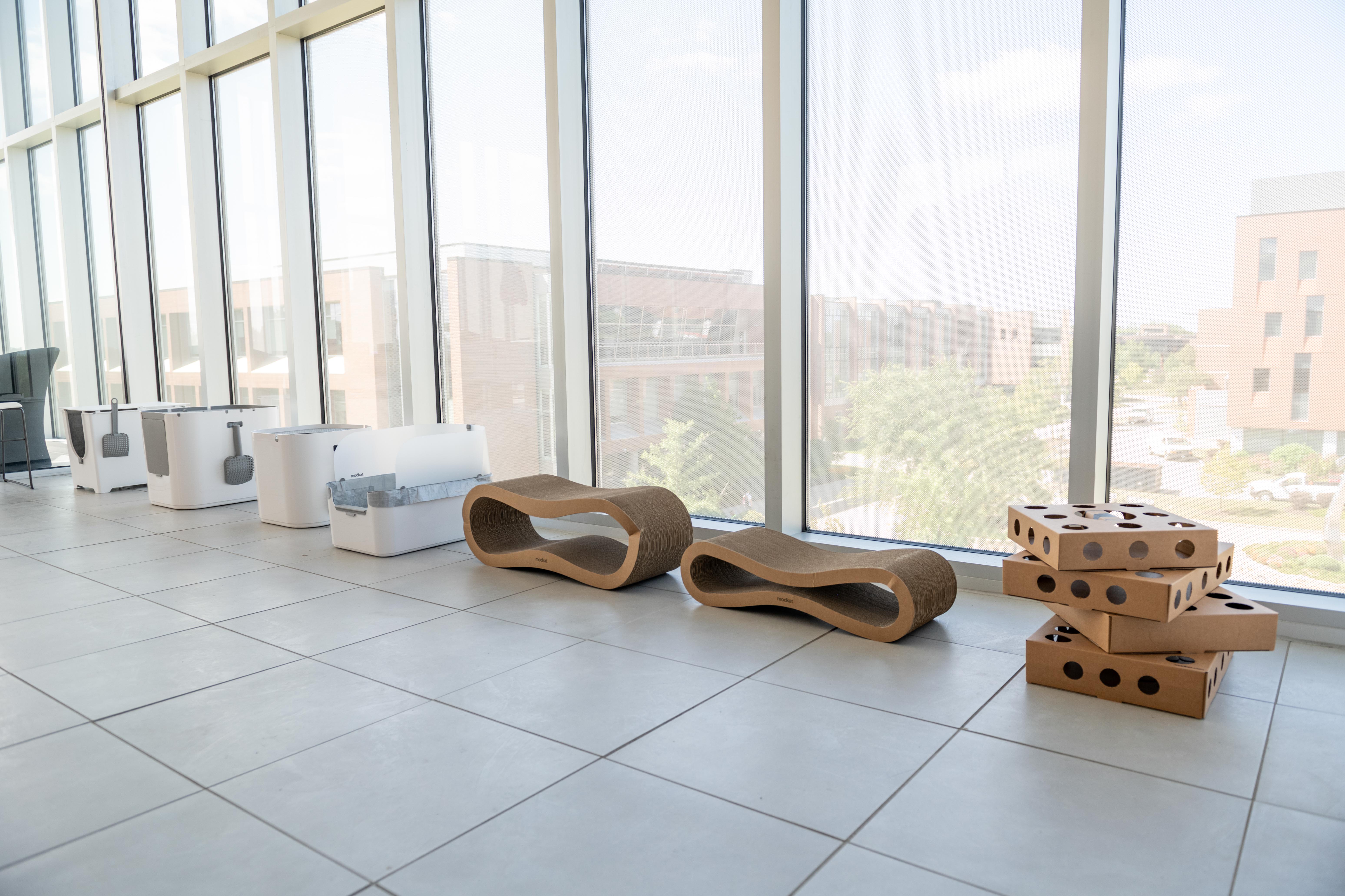 Modkat litter boxes line the wall of the Vignelli Center