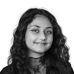 Black and white headshot photo Diya Das.