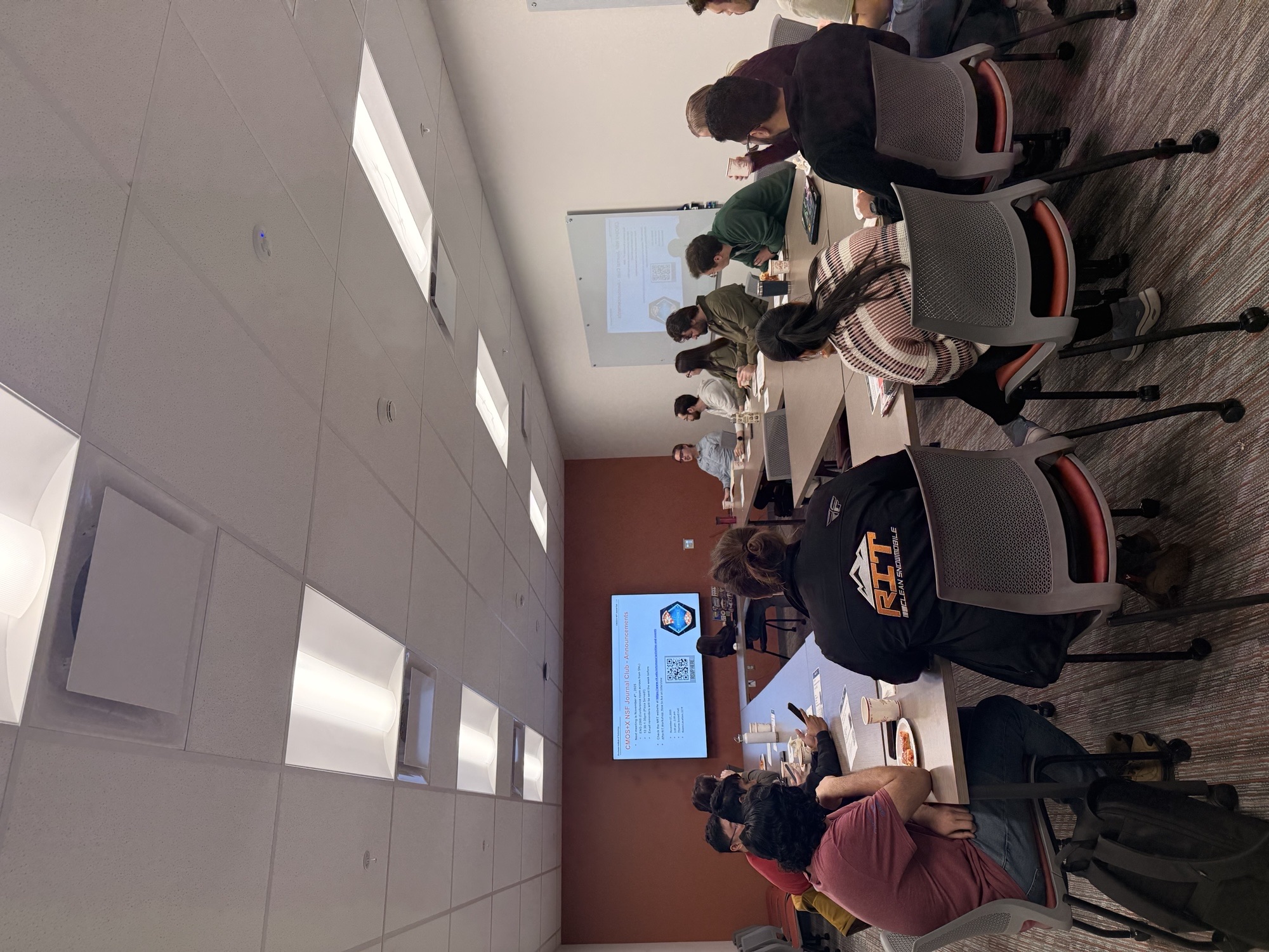 Group of students watching a presentation