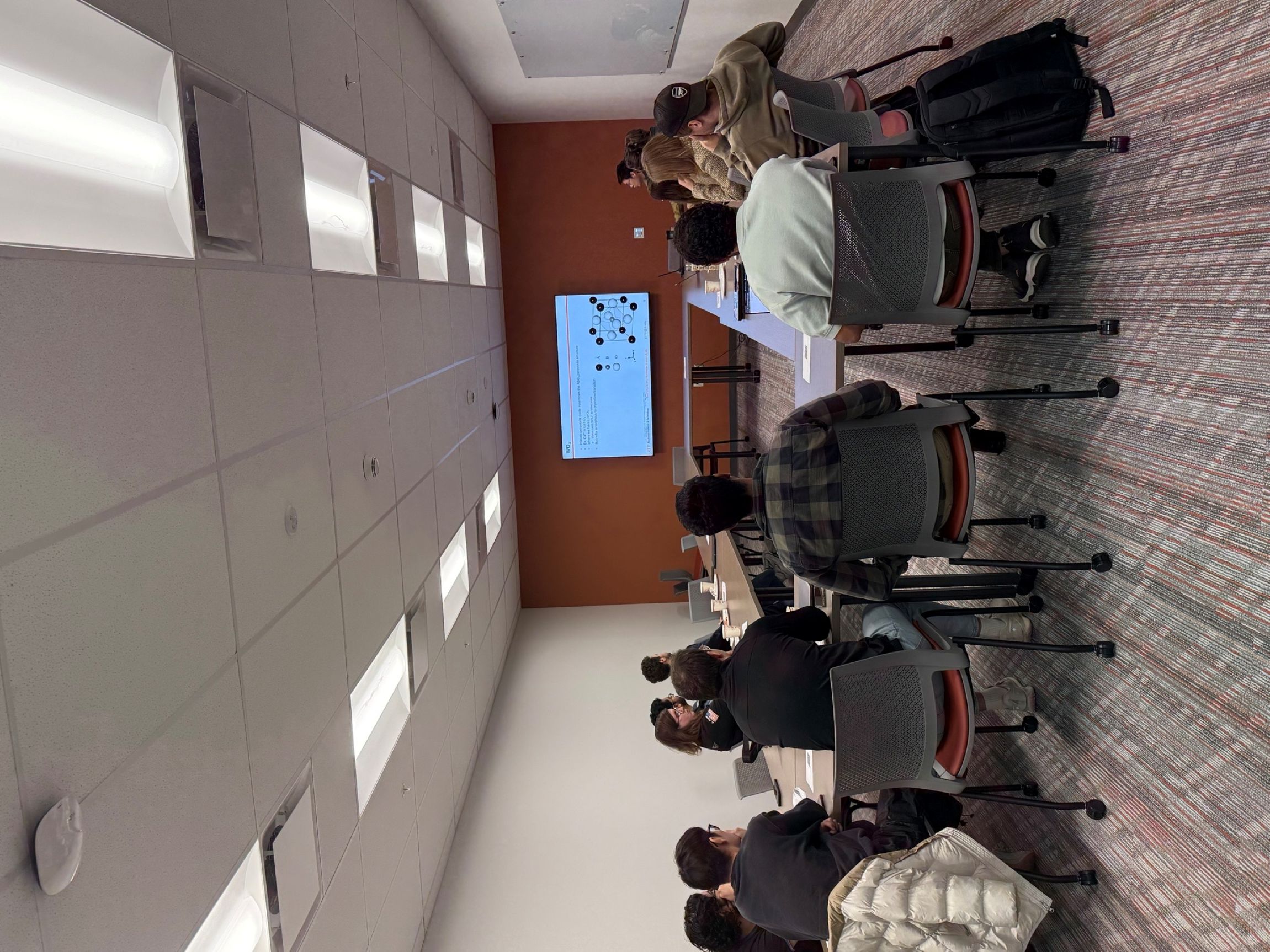 Image of a group of students listening to a presentation