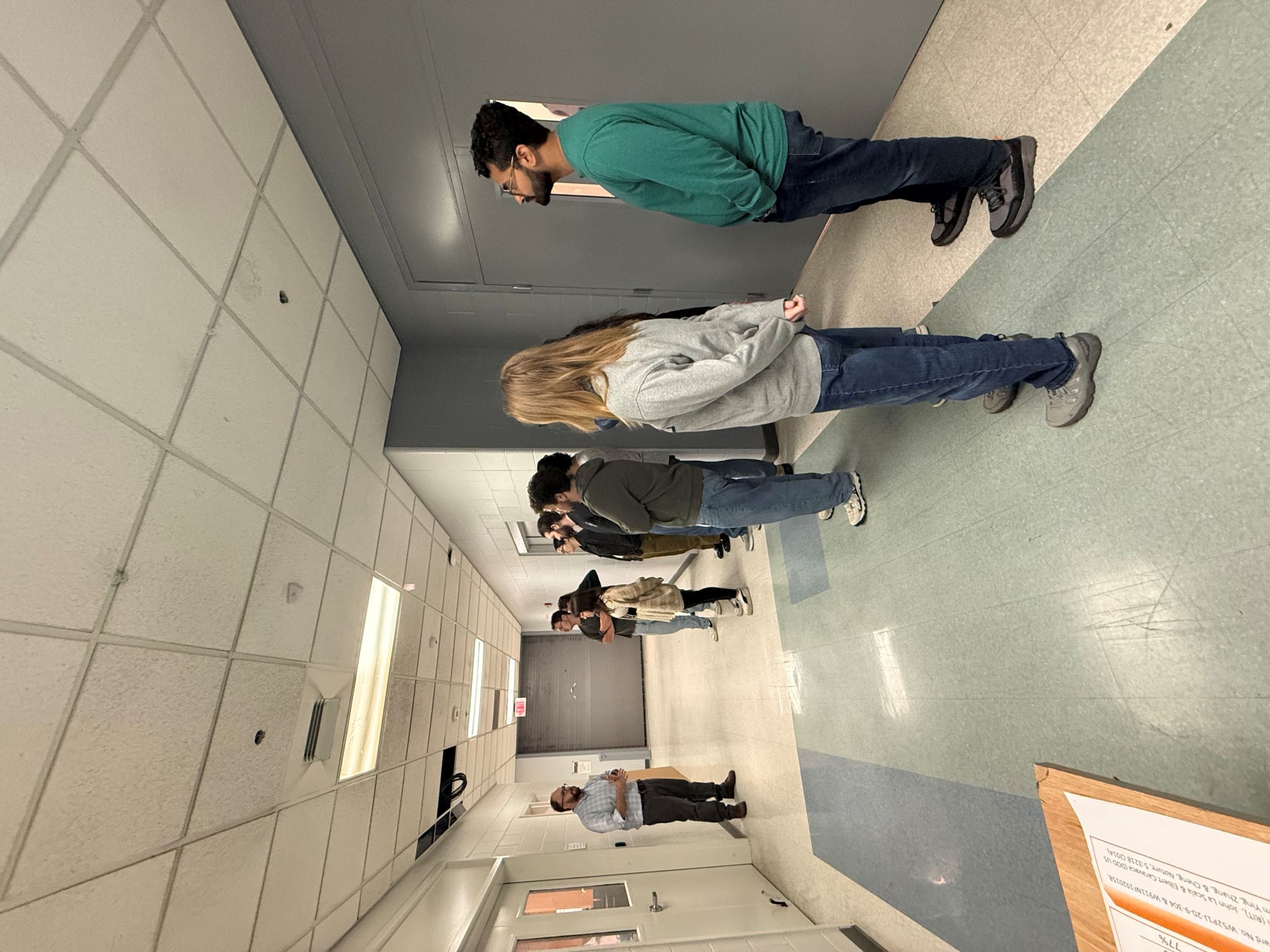 Professor Polly explaining the functions of NPRL's battery lab to trainees