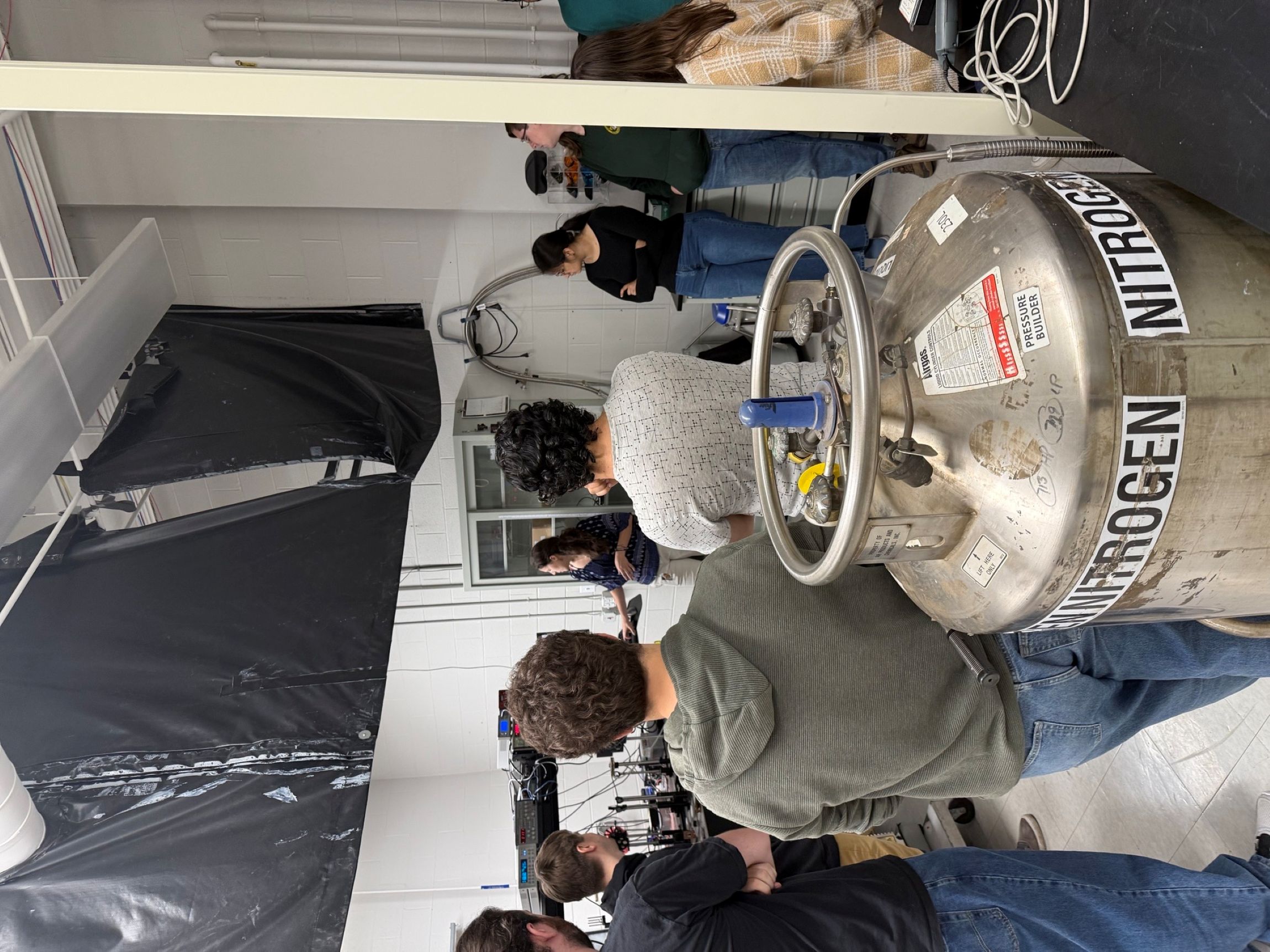 Trainees observing a demonstration of NPRL lab equipment