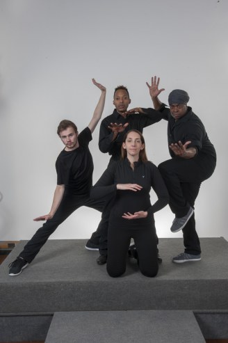 The four performers of Sunshine 2.0 strike a dramatic pose against a plain gray background.