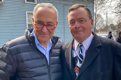 two men standing next to each other.