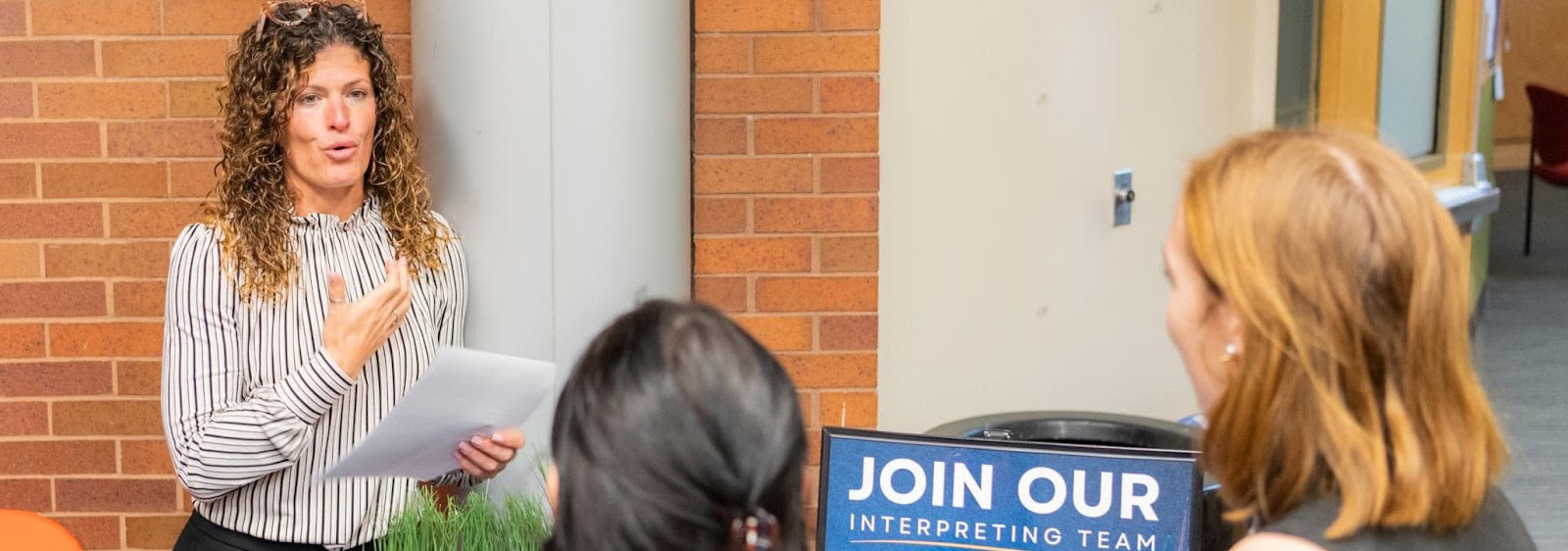 recruiter talking to students at career fair