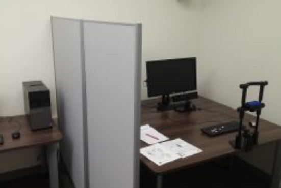 Photo of staff fitting research subject with electrode cap.