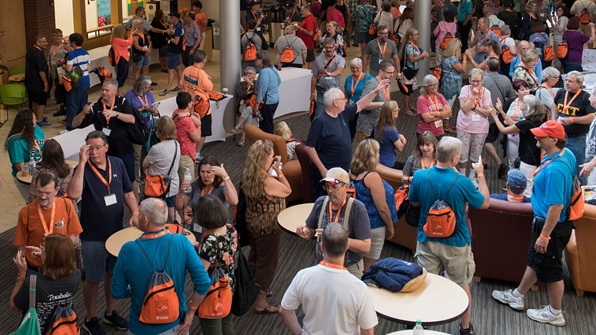 A large crowd of people gather for NTID's 50th anniversary