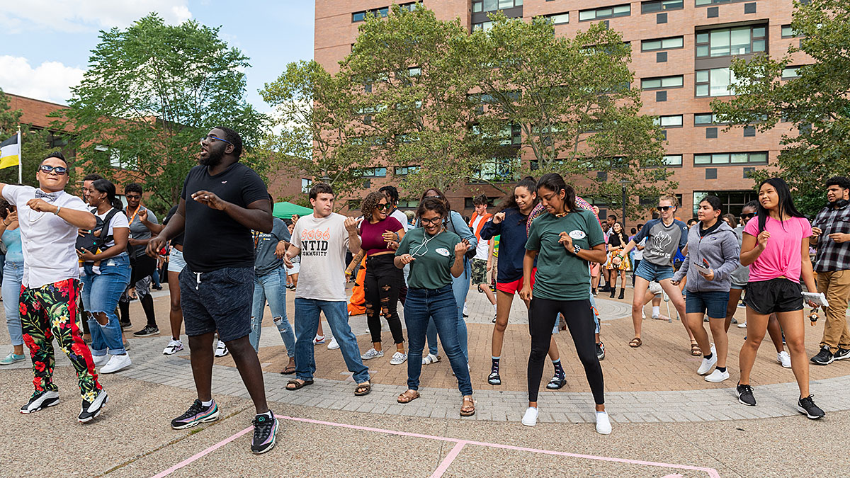 Large group of students dancing at NTID Applefest