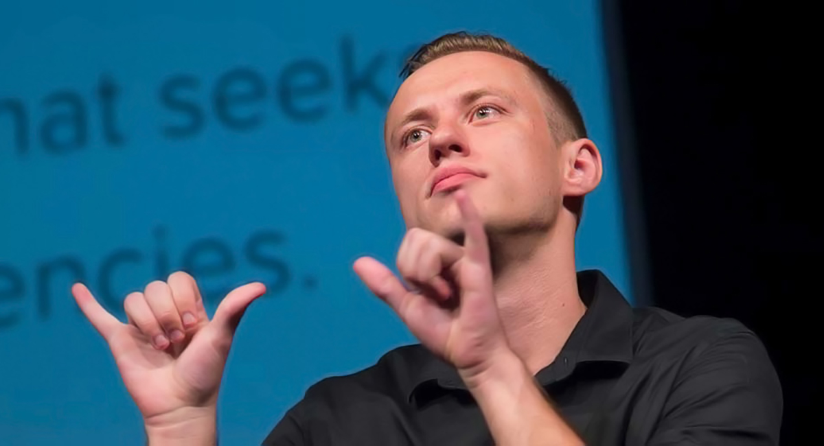 Man signing two y-shape hands