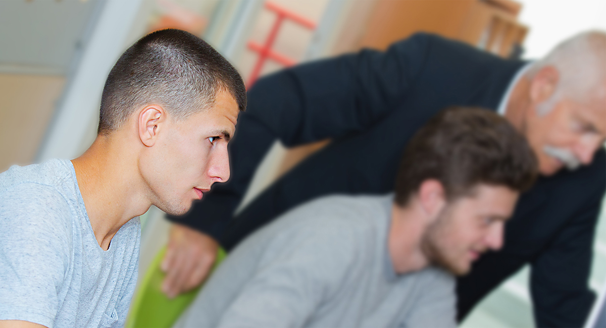 Vision impaired student getting help from instructor