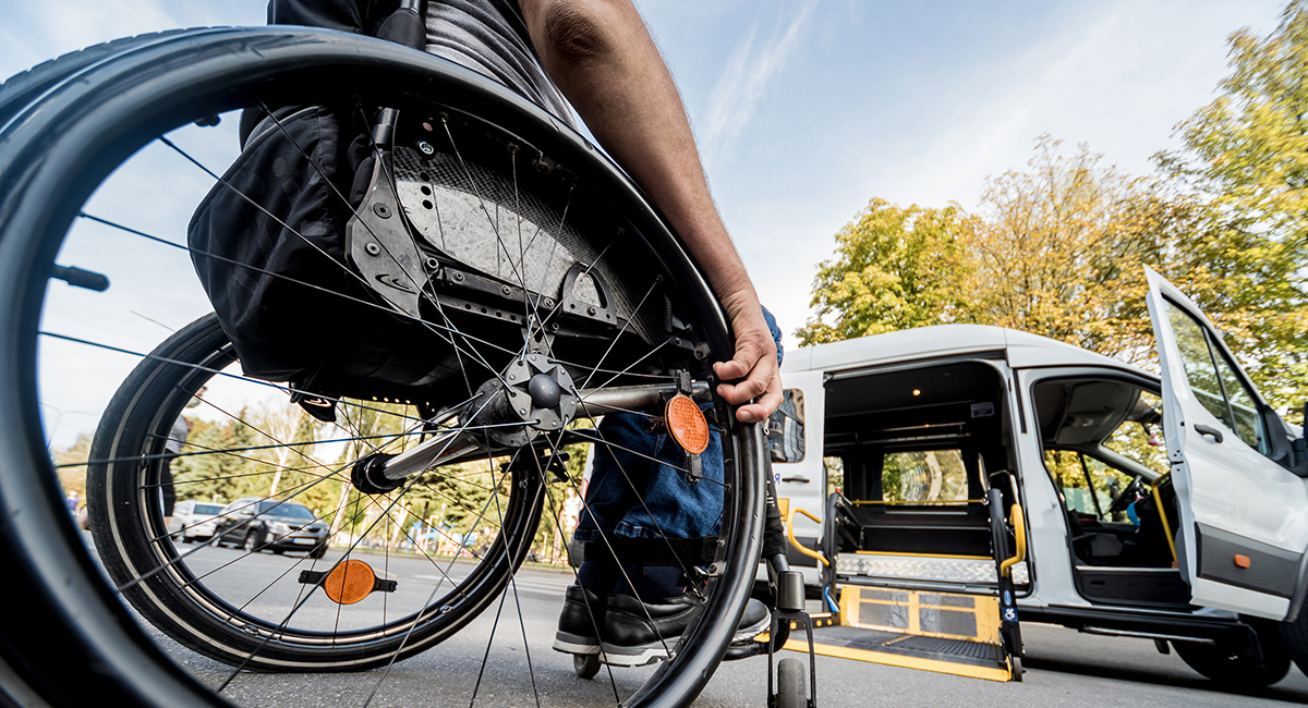 Student in wheelchair getting ready to enter transport van
