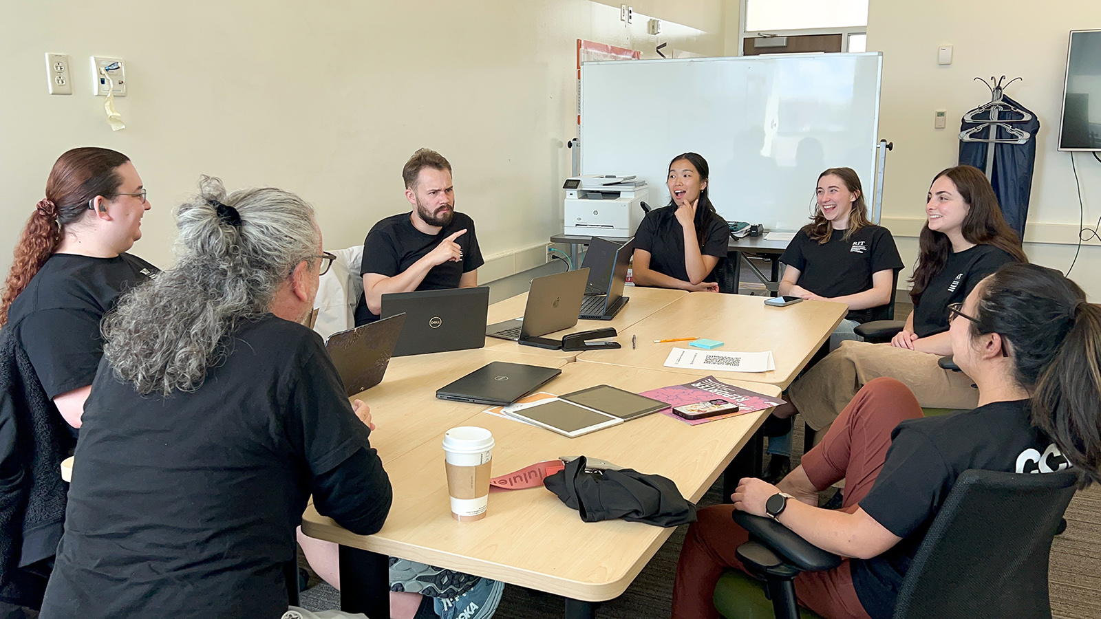 Work group sitting around conference table