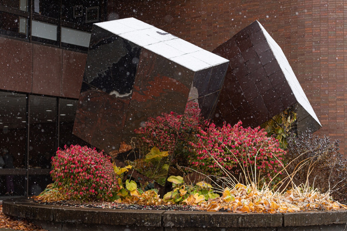 Photo of cube sculpture in front of the Lyndon Baines Johnson building at RIT/NTID
