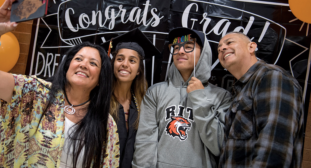 Parents and grads pose for selfie