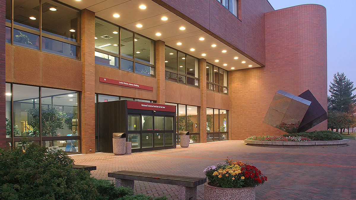 Photograph of the main entrance of LBJ Hall at dusk