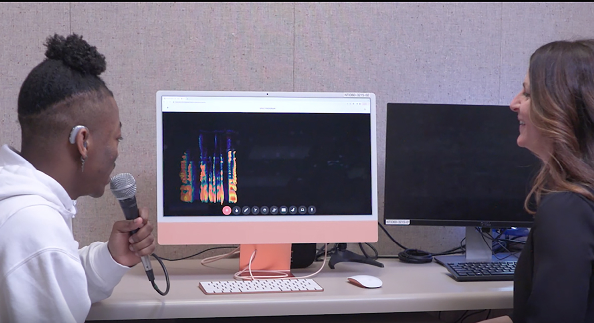 SLP working on speech production with student