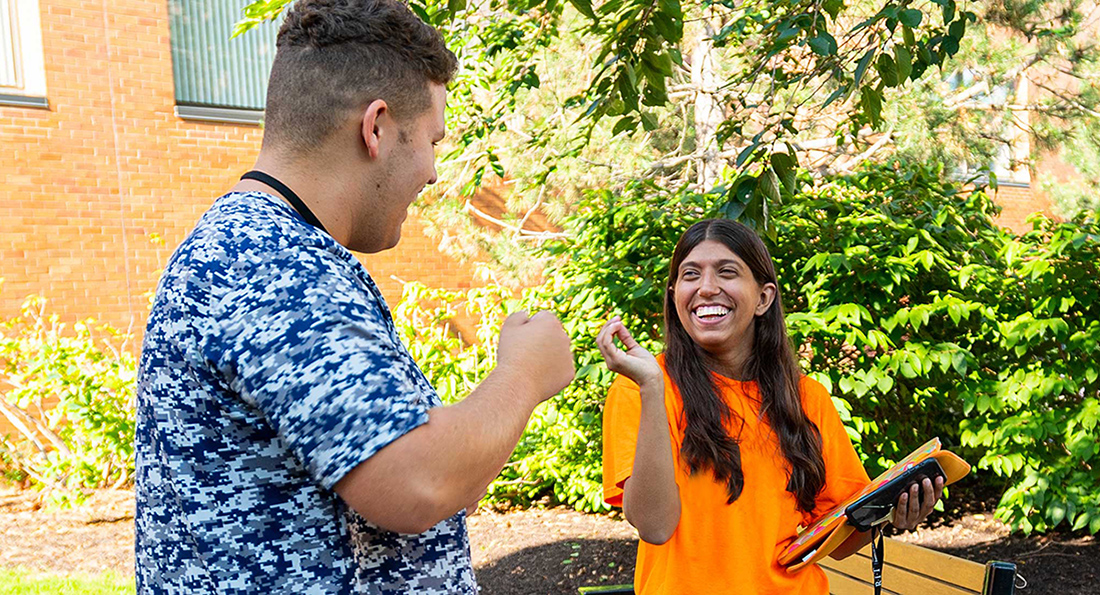 Students signing in NTID courtyard
