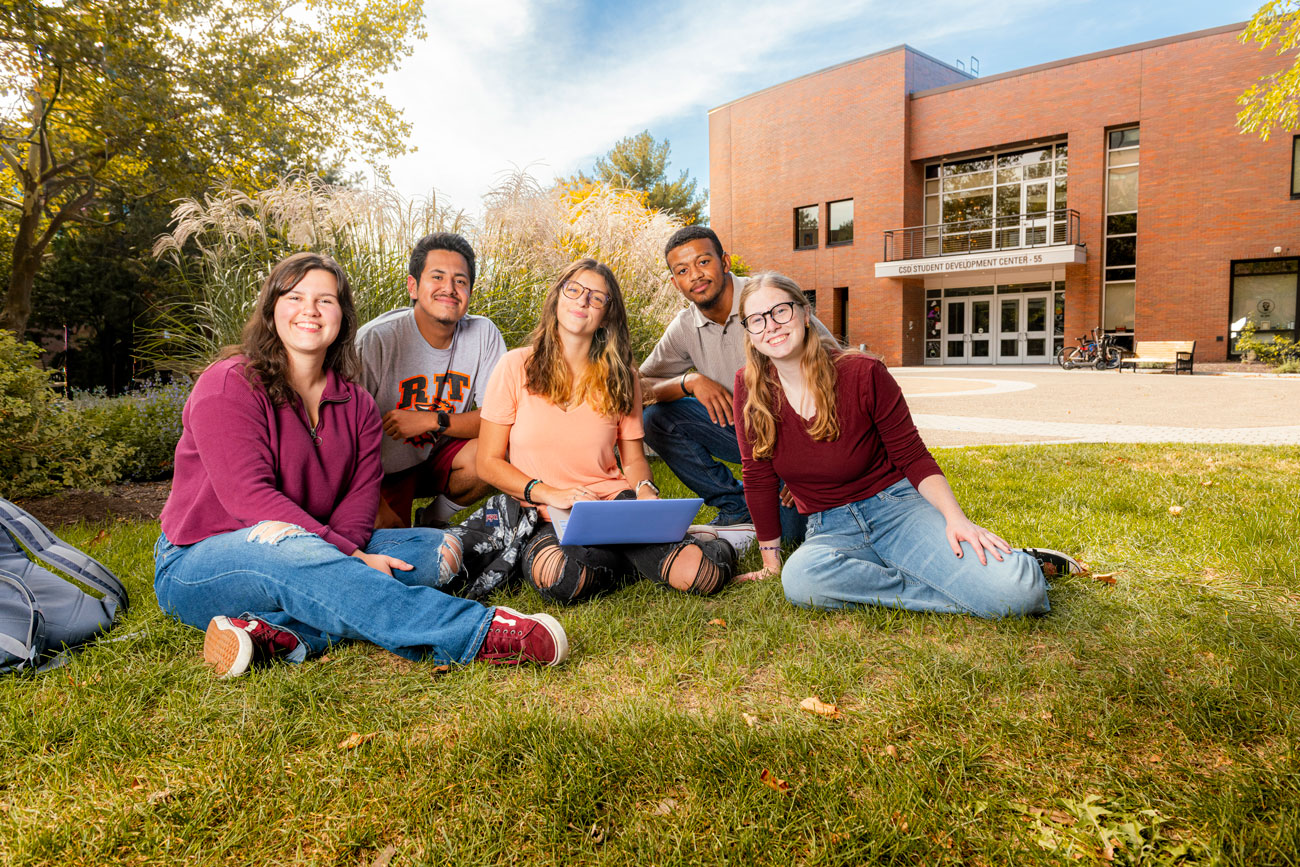Students smiling together on quad at RIT