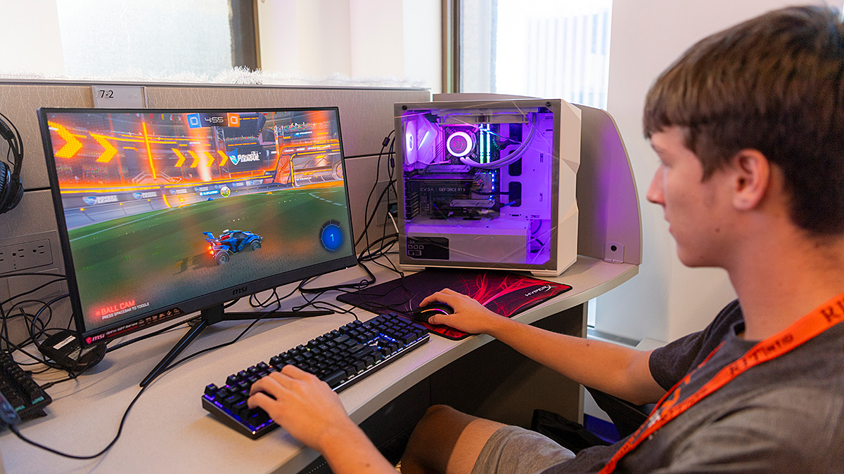 Student playing a video game on a computer