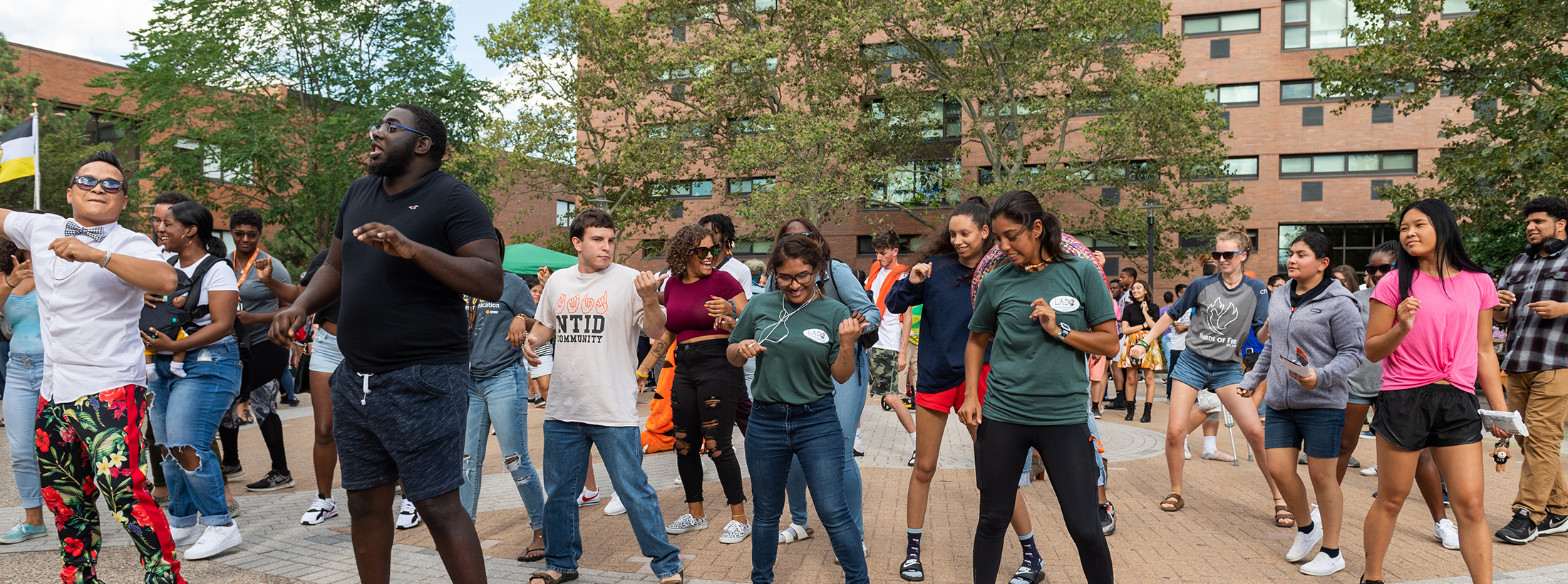 Diverse group of students dancing at NTID Applefest