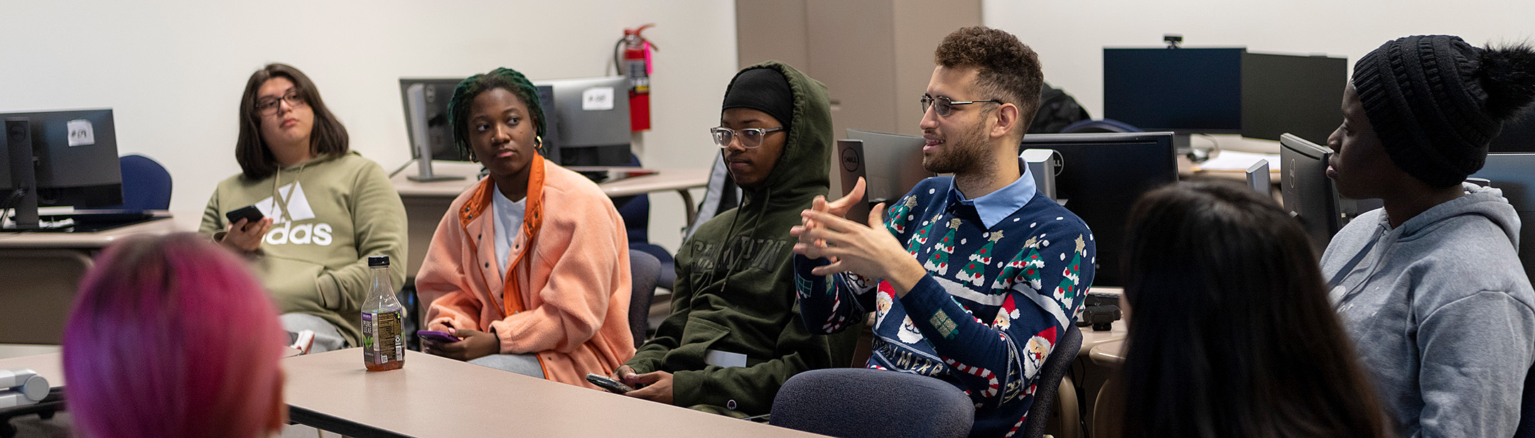 Business students in a group having a discussion