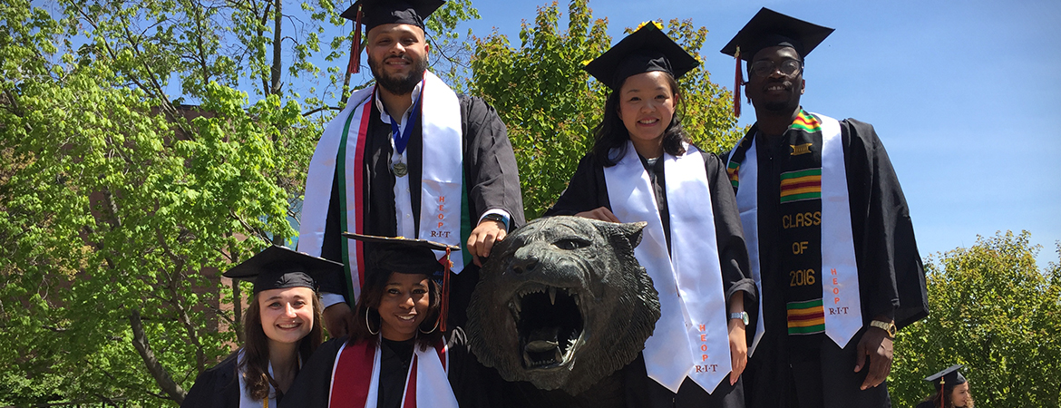 HEOP students standing around RIT tiger.