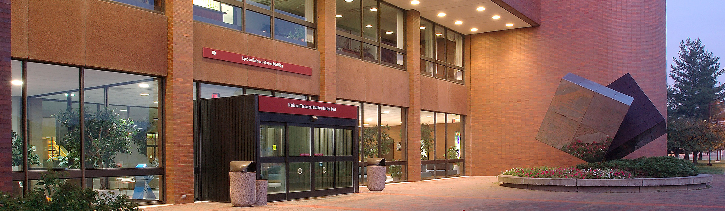 Photograph of the main entrance of LBJ Hall at dusk