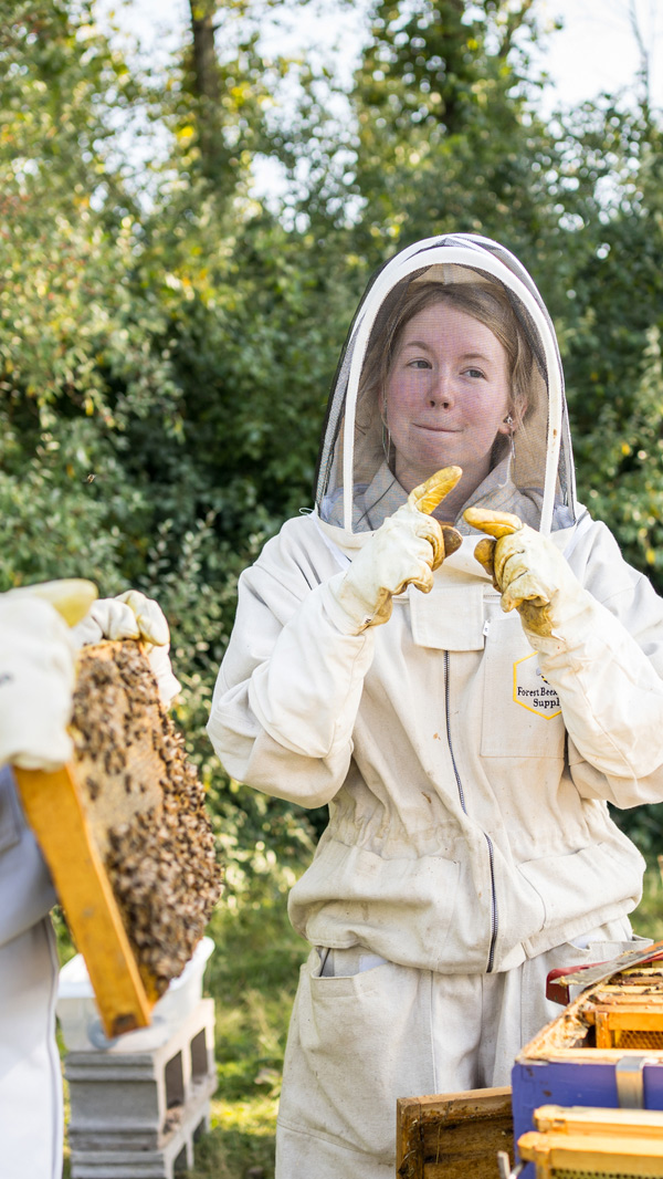ellie warren signing in a bee suit