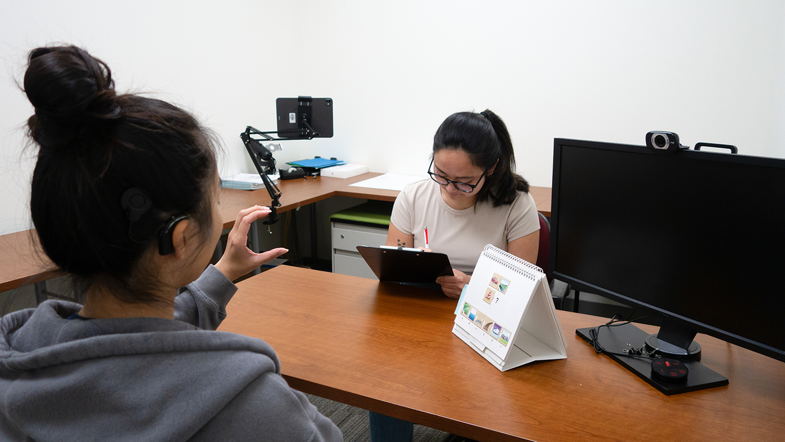 Subject responding and researcher taking notes