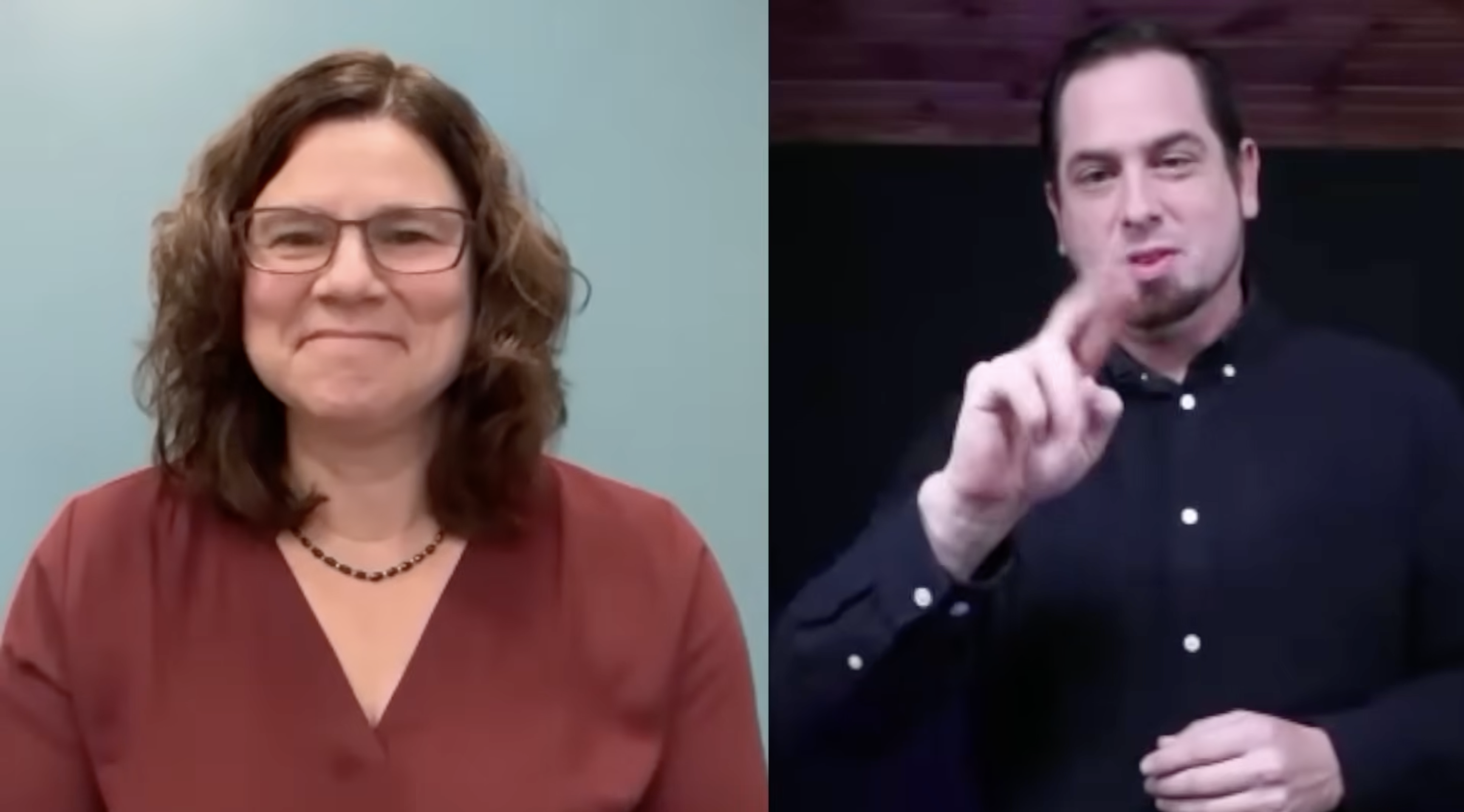 Split-screen video call showing two individuals: a smiling woman with curly hair and glasses on the left, and a man using sign language on the right.
